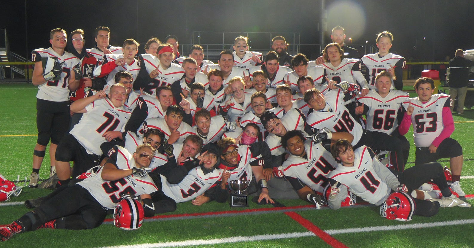 The Niagara-Wheatfield Falcons football team poses after winning the Chuck Funke Bowl Thursday night. The team finished 6-3. (Photos by David Yarger)